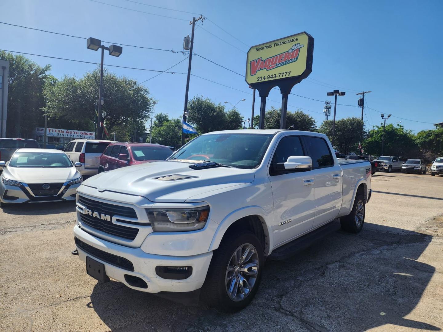 2019 white RAM 1500 Laramie Crew Cab LWB 4WD (1C6SRFRT3KN) with an 5.7L V8 OHV 16V engine, 8A transmission, located at 945 E. Jefferson Blvd, Dallas, TX, 75203, (214) 943-7777, 32.752514, -96.811630 - Photo#0